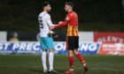 Thistle's Kevin Holt speaks to Inverness' Kirk Broadfoot during the cinch Championship match between Partick Thistle and Inverness CT at Firhill.