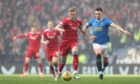 Aberdeen's Ross McCrorie and Rangers' Ryan Jack in action at Ibrox.