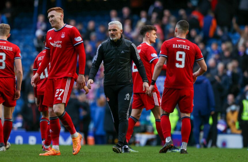 Jim Goodwin on pitch with Aberdeen players