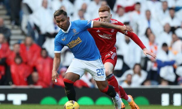 Alfredo Morelos and David Bates in action at Ibrox.