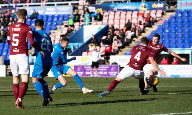 Reece McAlear scores in Caley Thistle's 3-0 win over Arbroath in March.