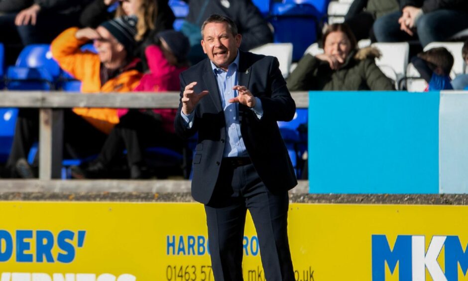 Inverness head coach Billy Dodds gesticulating on the pitch.