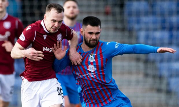 Joe Hardy, right, battles for possession with Arbroath's Chris Hamilton.