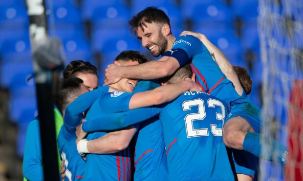 Inverness players celebrate after Billy Mckay rounded off the scoring.