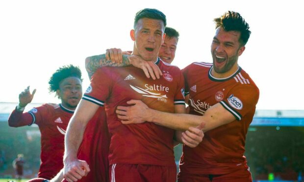 Lewis Ferguson celebrates after scoring to make it 2-1 against Hibs.