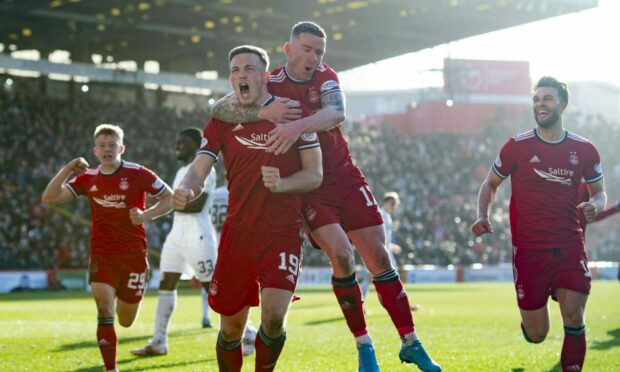 Aberdeen midfielder Lewis Ferguson celebrates after scoring to make it 2-1 against Hibs.