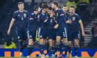 Scotland's Kieran Tierney celebrates making it 1-0 with teammates during the friendly with Poland