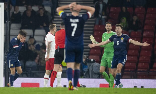 Kieran Tierney complains after the  Poland penalty is awarded.