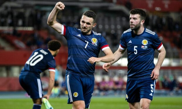 John McGinn celebrates scoring to make it 2-0 Scotland against Austria in Vienna.