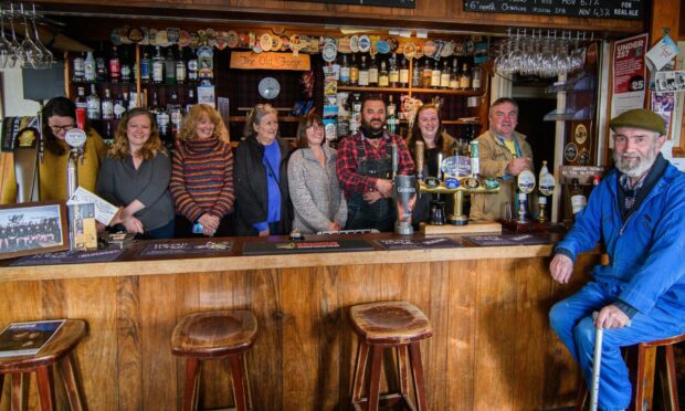 The Old Forge Community Benefit Society behind the bar.