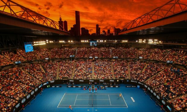A stunning view of Rod Laver Arena at sunset in Melbourne. Photo by Scott Barbour/Getty Images