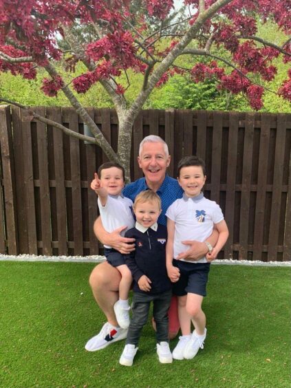 George Thom with grandchildren Luke, 3, Alfie, 3, and five-year-old Louis. 
