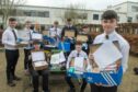 A group of Bucksburn Academy pupils with shoeboxes