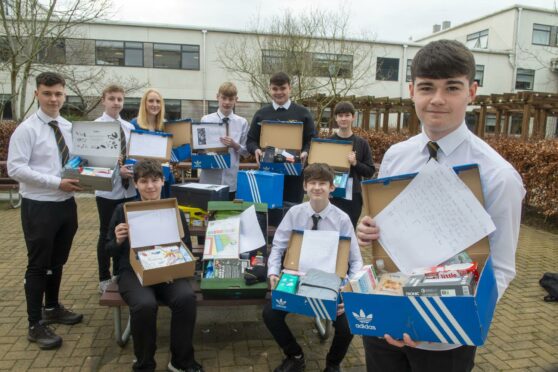 A group of Bucksburn Academy pupils with shoeboxes
