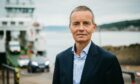 CalMac chief executive Robbie Drummond standing in front of a boat loading.