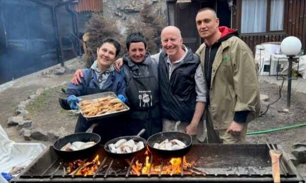 Andy Kent, third from left, with friends at a barbecue.