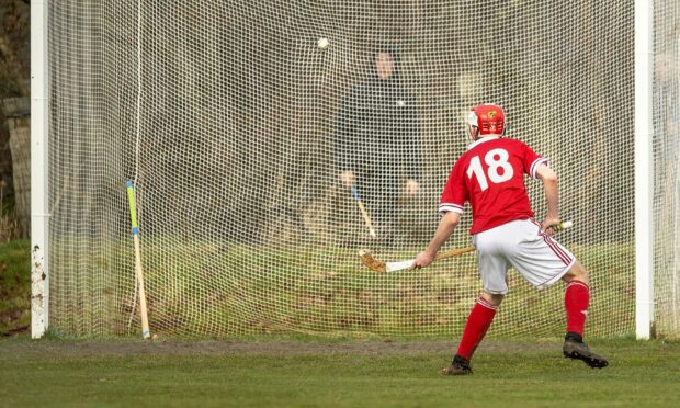 On his first Premiership start, Zander Macrae scores into an unguarded goal for Kinlochshiel.