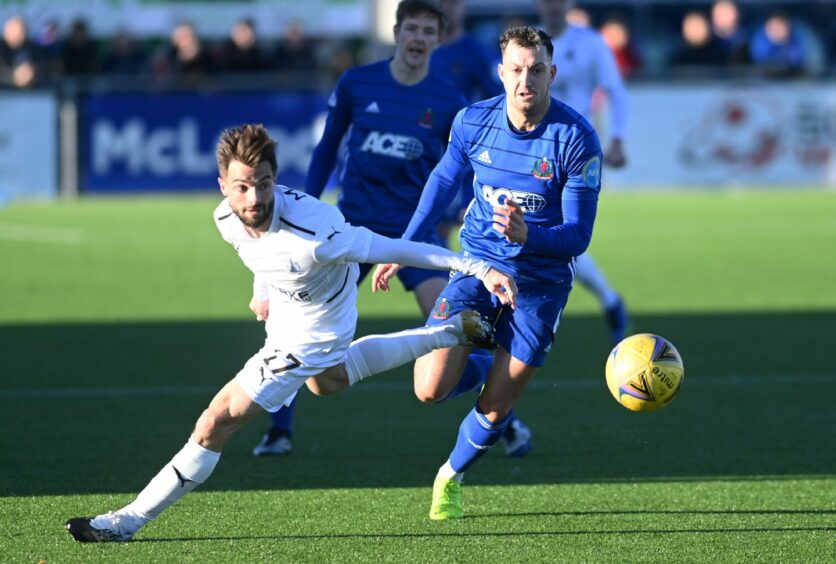 Cove Rangers' Connor Scully goes up against Falkirk's Keaghan Jacobs