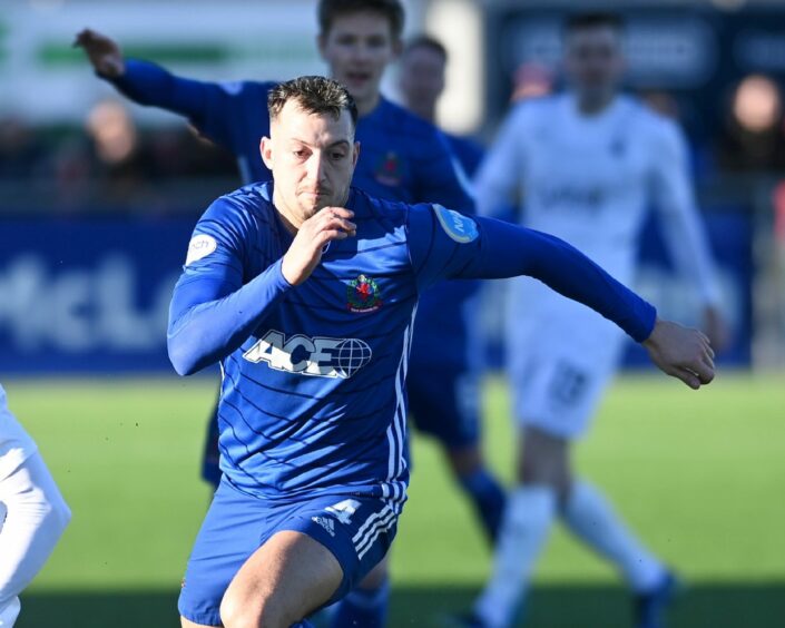 Connor Scully in action for Cove Rangers