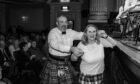 Couple dancing to Scottish fiddle music