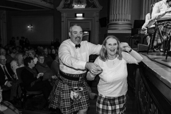 Couple dancing to Scottish fiddle music