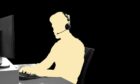 A silhouette of a person at a computer wearing a headset