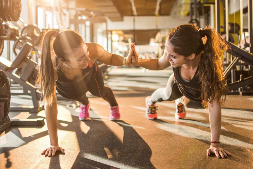 Women working out together at a gym