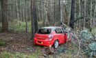 It is believed that the red Vauxhall Astra left the road and collided with a tree.