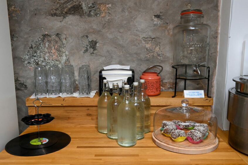 Bottles of water and sweet treats on the counter of The Red Robin Records Vinyl Café
