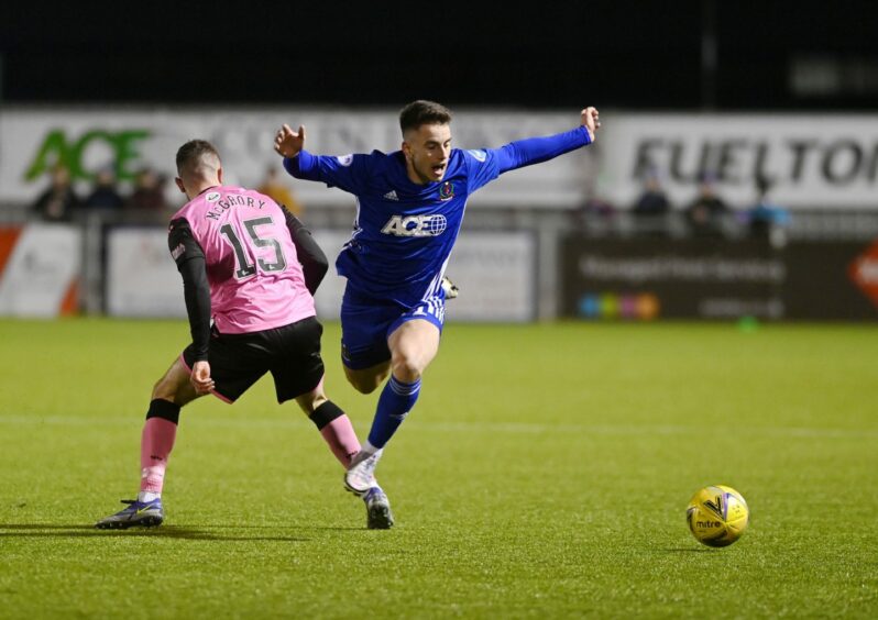 Cove Rangers' Robbie Leitch is upended by Calvin McGrory