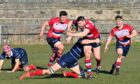 Ben Renton on the ball for Aberdeen Grammar against Musselburgh. 
Picture by Kenny Elrick