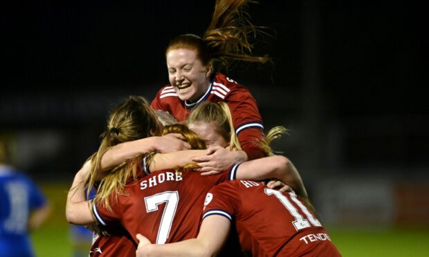 Aberdeen Women's Hannah Stewart, centre, is hoping to to keep making an impact on the pitch.