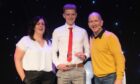 Aaron Odentz was named the Young Coach of the Year at the 2022 Aberdeen's Sports Awards. He is pictured alongside Original 106 presenter Claire Stevenson and awards host Eddie 'the Eagle' Edwards.