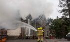 Firefighters dousing the flames at the Braemar Lodge Hotel. Picture by Kath Flannery