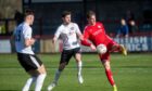 Brechin's Kevin McHattie, right, clears under pressure from Tom Kelly, centre, and Max Ewan of Brora Rangers