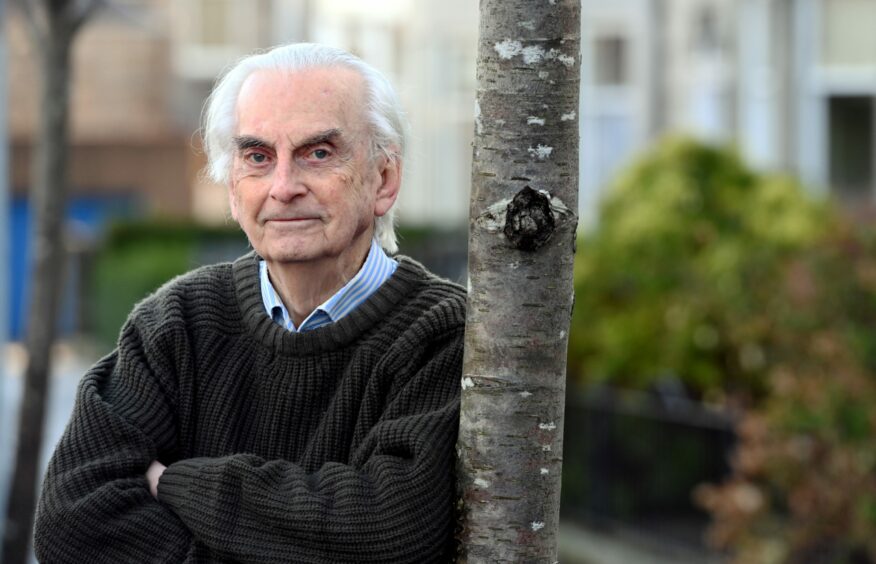 Photo of Professor Pennington standing next to a tree