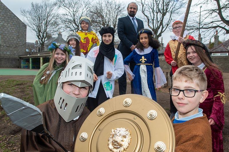 Cllr Malik and the Kittybrewster pupils, in full medieval costume, who starred in "Stories from St Machar's"