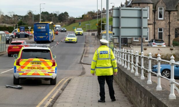 Police closed off Bridge Street for nearly four hours after a man was taken to hospital following the crash. Picture by Brian Smith.