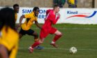 Lossiemouth's Ross Morrison, right, tries to get away from Darren Brew of Fort William