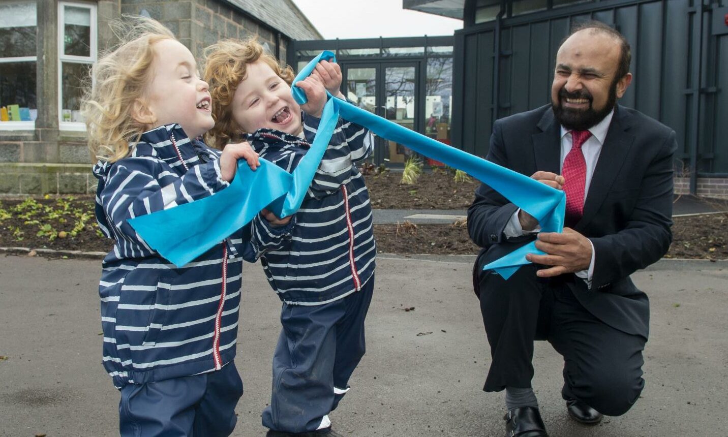 Pre-schoolers helped Councillor M Tauqeer Malik 'cut' the ribbon t the grand opening of the Duthie Park outdoor nursery on Thursday.