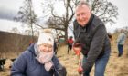 National Lottery winners Sheila and Duncan Davidson volunteering at Trees for Life. Supplied by National Lottery.