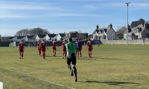 Orkney taking to the field at Golspie Sutherland.  Picture by Orkney FC