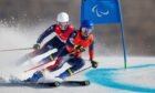 Neil Simpson with his guide Andrew Simpson competing in the men's Giant Slalom Vision Impaired Para Alpine Skiing at the Yanqing National Alpine Skiing Centre.