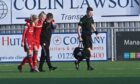 Francesca Ogilvie was helped off against Celtic by captain Kelly Forres after pulling up injured. Picture by Paul Glendell.