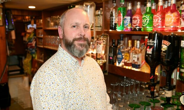 Jonney Gardner, the owner of Harbour Bar in Gourdon, is raising money for those in Ukraine by shaving his beard off. Picture by Paul Glendell.