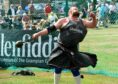 Deeside's own Craig Sinclair throwing the 28lb weight with ring
at Aboyne Highland Games in 2018. Picture by Kenny Elrick.