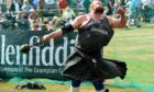 Deeside's own Craig Sinclair throwing the 28lb weight with ring
at Aboyne Highland Games in 2018. Picture by Kenny Elrick.