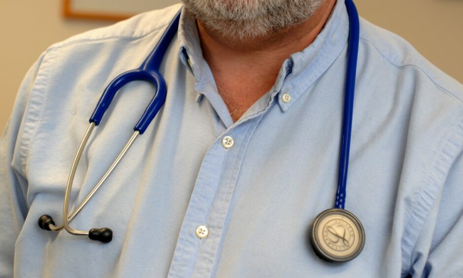 Close up of a GP wearing a stethoscope