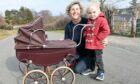 Caroline Haswell and her great-nephew Magnus with her 64-year-old Triang pram from Benzies, Inverness.