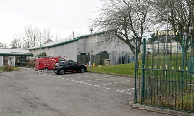 Work crews were seen at Kinmylies Primary School in Inverness on Friday. Photo: Sandy McCook/DCT Media